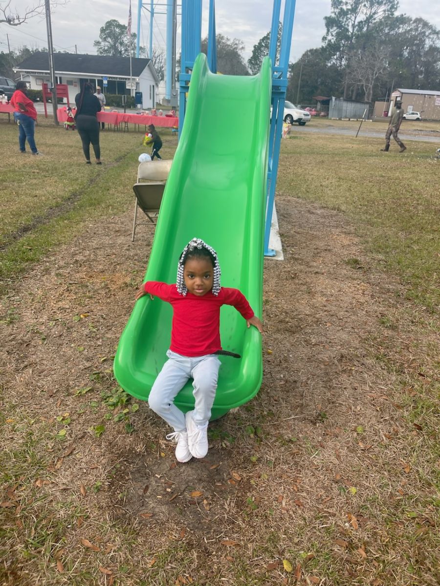 child playing on slide