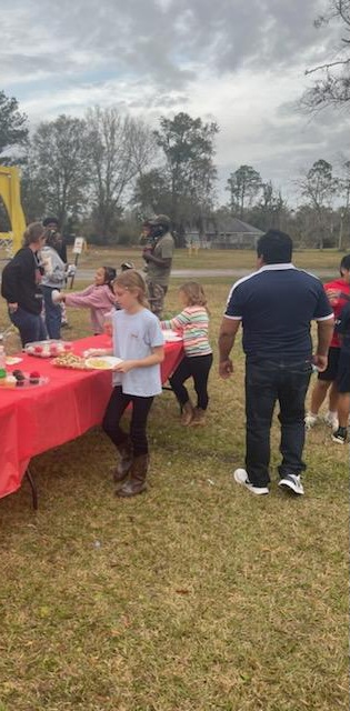 people and children at christmas park event