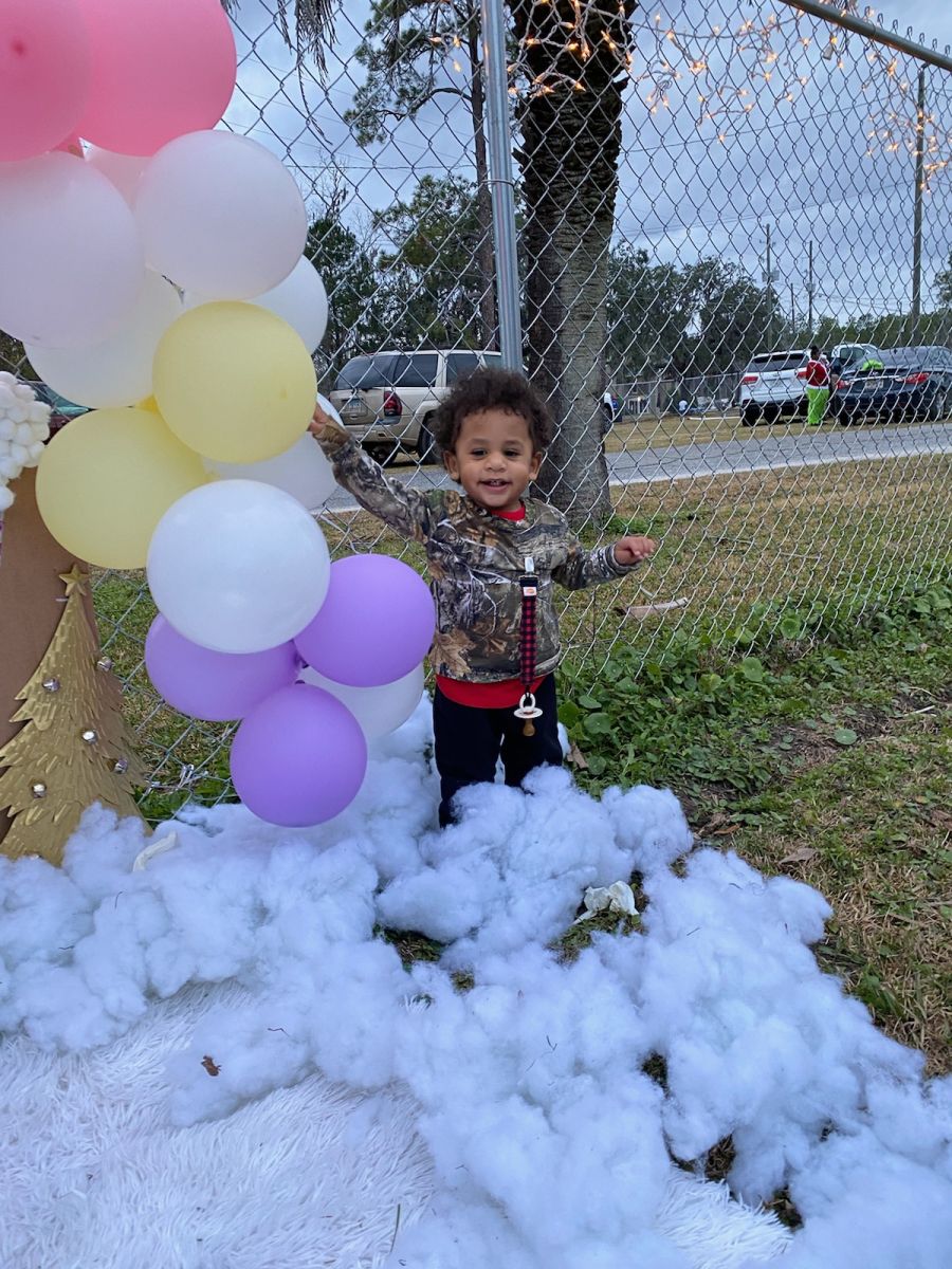 child playing at park in snow foam