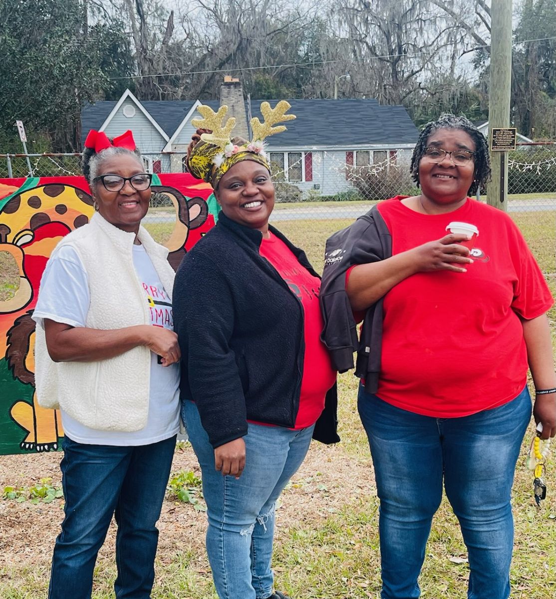 three people at park christmas event