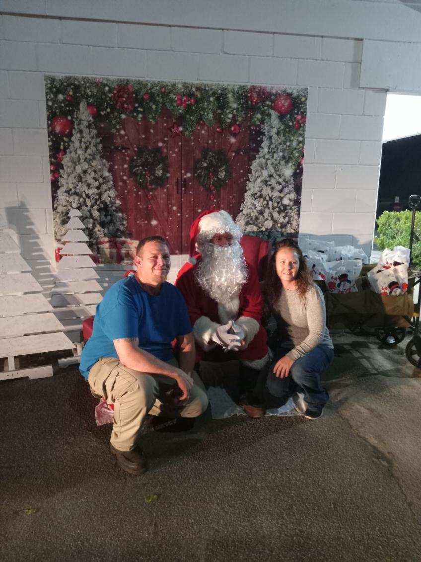 santa and two people